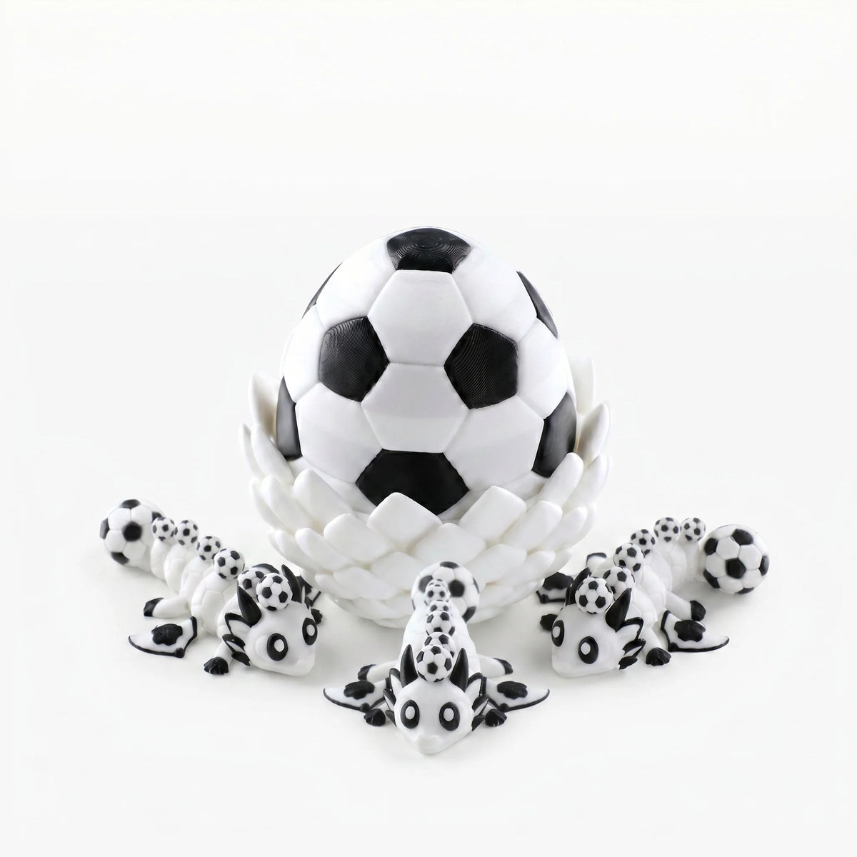 3D printed dragon egg with three articulated mini dragons