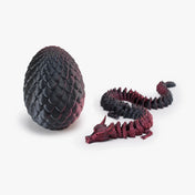 Flexed Nexbie 3D printed articulated dragon with eggshell